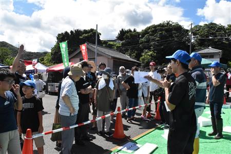 競り